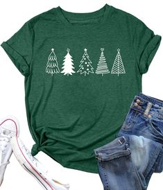 PRICES MAY VARY. 【Premium Fabric】This christmas tree is crafted from cotton blend, soft, stretchy, lightweight, the comfymaterial will catch your favorite. 【Xmas Holiday Shirt Tops】Christmas shirts for women, christmas tree print graphic tees, funny xmas tees tops, woman christmas tshirts, christmas gift shirts tops, chic short sleeves graphic tees and round neck will let you see the high quality of t-shirts! cute christmas trees letter t-shirt makes you look more approachable and vitality! 【Occasion】This xmas graphic t shirts very suitable for Christmas, home, street, photo, school, work and casual, Perfectly match your favorite skirt and denim shorts. will make you brightly. 【Best Christmas Gift】 This Christmas tree shirts is a perfect christmas gift, you can buy it to yourself, or you c Christmas Tree Shirt, Xmas Shirts, Tree Shirt, Funny Christmas Shirts, Printed T Shirts, Shirt For Women, Graphic Tee Shirts, Christmas Women