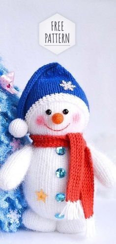 a knitted snowman next to a blue christmas tree with the words free pattern on it