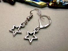 Star earring, Double star dangle, Silver star, Men star earring, For men, Star is born, Star earring, Chain earring, Celestial jewellery One  star earring  Length 2 inches ( 5 cm ) Choose suitable ear hook. The Star presents us with one of the most beautiful and enchanting of all Symbols. The Star Symbolizes: Aspiration, Inspiration, Imagination, Wonder, Dreams, Pursuits, Magic (the Magical), Creative Brilliance, and Divine Guidance. Delivery time to Europe is 7 to 14 working days. Delivery time to US or the rest of the world - 14-30 working days. Star Charm Earrings For Jewelry Making, Nickel-free Star-shaped Earrings For Jewelry Making, Star-shaped Earrings With Lever Back For Gifts, Bohemian Silver Star Earrings, Adjustable Star-shaped Metal Earrings, Star-shaped Metal Earrings With Dangling Charms, Bohemian Silver Star-shaped Earrings, Celestial Earring, Earring Star