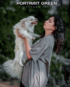 a woman holding a white dog in her arms with the caption portrait green lightroom preset