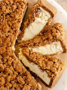 a close up of a cake on a plate with crumbs and ice cream