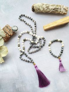 This mala necklace is made with 108 natural stone beads of magic labradorite and white howlite adorned with silver beads. This prayer garland  is the perfect support garland for counting mantras during your practices. Its a 108 knotted beads mala, very light weight, an spiritual sacred jewelry for chakra healing. I make each mala by hand, knotting each of the 108 beads with great care and I made every single silky and delicate tassel. I use a very resistant braided macrame rope, achieving a mala that lasts over time. All our malas are very versatile, since you can use them on many occasions. This prayer garland has two beads size:  - small 6mm.  50 cm / 20 inch - large 8mm. 64 cm / 25 inch Spiritual Stone jewels choose personally every single gemstone for her prayer garlands, to ensure his Labradorite Bead Jewelry As A Gift, Handmade Spiritual Gray Necklaces, Gray Spiritual Round Bead Jewelry, Bohemian Gray Jewelry With Natural Stones, Gray Round Beads Spiritual Jewelry, Bohemian Howlite Jewelry For Healing, Handmade Howlite Spiritual Jewelry, Handmade Spiritual Howlite Jewelry, Adjustable Natural Stones Mala For Meditation