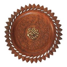 a wooden bowl with an intricate design on it