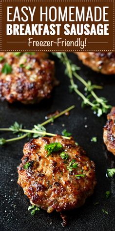 some meat patties on a black plate with herbs and seasoning in the background