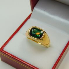 Gemstone: Blue Green Tourmaline Treatments: None Measures: 10x8mm ring Weight: 2.18 carats Clarity: Eye clean Cut: Rectangle cushion cut Metal: Shown in 18K yellow gold Weight: Approx. 12 grams Ring size: This ring is available in all sizes from a low of 5 to a high of 12 This is as fine and elegant a man's ring as you will ever find. The perfect blend of a fine gemstone matched up with a clean classic 18K yellow gold ring. Good solid weight, nicely distributed to give the ring an even weight so Formal Gold Sapphire Ring For May Birthstone, Modern Emerald Signet Ring For Formal Occasions, Gold Emerald Signet Ring For Formal Occasions, Formal Polished May Birthstone Signet Ring, May Birthstone Polished Finish Signet Ring For Formal Occasions, Formal May Birthstone Signet Ring With Polished Finish, Formal Emerald Gemstone Signet Ring, Formal Yellow Gold Emerald Signet Ring, Gold Mens Ring