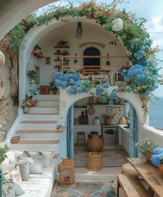 an archway leading to a living room with blue flowers on the wall and steps up to it