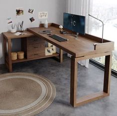 a wooden desk sitting in front of a window next to a rug and wall mounted television