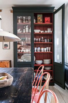 the kitchen is clean and ready to be used for dinner or lunchtime, with dishes on display