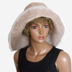 Size 57 cm. The hat is made of eco-friendly breathable linen fabric with a melange effect. Hat with asymmetrical brim. The back brim of the hat is wider than the front. The hat is decorated with mesh fabric and small decorative shells. Summer linen wide-brimmed sun hat in beige color. Hat with cotton lining. Wide-brim Lightweight Hat For Beach Season, Lightweight Wide Brim Hat For Beach Season, Lightweight Wide Brim Straw Hat For Spring, Lightweight Brimmed Straw Hat For Spring, Lightweight Fedora Sun Hat For Summer, Lightweight Summer Fedora Sun Hat, Lightweight Sun Hat With Curved Brim For Summer, Lightweight Wide Brim Hat For Spring, Lightweight Summer Sun Hat With Curved Brim