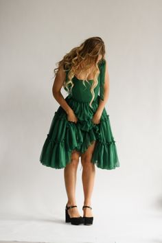 Dark Green Ruffled Dress For Party, Dark Green Elegant Ruffle Dress, Elegant Dark Green Dress With Ruffles, Elegant Dark Green Ruffled Dress, Green Mini Dress With Fitted Bodice, Fitted Bodice Green Dress With Ruffles, Green Ruffled Dress For Costume Party, Elegant Green Dress With Ruffled Skirt, Elegant Green Dress With Tiered Skirt