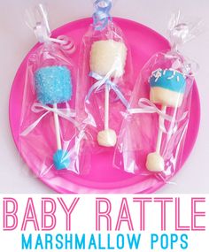 baby rattle marshmallow pops on a pink plate