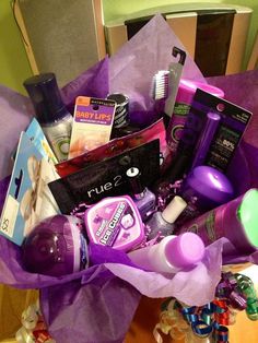 a purple bag filled with lots of beauty products