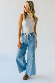 Be the center of attention with The Towslee Wide Leg Denim Jean! These light blue jeans are not your ordinary pair. The wide leg design effortlessly elongates your figure, while the light blue color adds a playful touch to your outfit. Perfect for standing out in any crowd! Details Model is wearing a small self/lining: 100% cotton Fabric Care Guide Here Sizing & Fit Measurements are approximate and taken while laying flat across the front. Not doubled. small: waist = 12"; length = " medium: wais Ruffled Denim Jacket, Wrap Sweater Dress, Velvet Midi Dress, Floral Sweater, Ruched Bodice, Light Blue Jeans, Leg Design, Pattern Sweater, Wrap Sweater