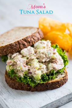 a tuna salad sandwich with lettuce and tomatoes