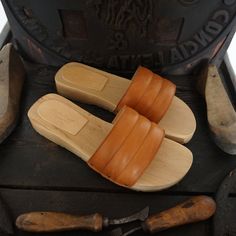 Woman Clogs in natural wood and Real Leather , handmade by Mario Doni. Man Clogs Model: Francesco Clogs color: Natural Heel: 30 mm Upper: Genuine leather Vegetable Color: Leather * On request also available in other colors Sabot made of wood in the best tradition of craftsmanship Tuscany. Uppers made of genuine leather Vegetable-available in a wide selection of colors to give joy to your Summer All our products are made exclusively to order, please contact me for further editing. Wooden Slip-on Mules, Leather Clogs With Wooden Heel In Natural Wood Color, Natural Wooden Clogs With Wooden Heel, Wooden Slip-on Clogs With Wooden Heel, Wooden Mules With Rubber Sole And Round Toe, Natural Wooden Heel Clogs, Natural Wood Round Toe Clogs, Natural Wood Clogs With Wooden Heel, Natural Color Wooden Heel Slip-on Clogs