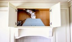 a stove top oven sitting inside of a kitchen