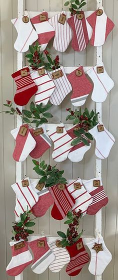 christmas stockings hanging on a white ladder