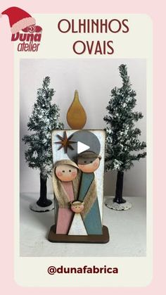 an ornament with two people in front of trees and a pink background that says, ohhnhos ovais