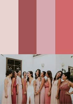 a group of women standing next to each other in front of a white building with red and pink colors