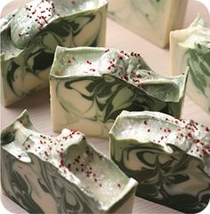 several pieces of green and white soap with sprinkles on them sitting next to each other