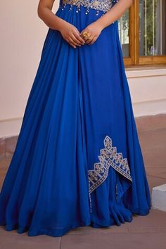 Blue layered anarkali with tilla, dori, pearl, handmade tassels, brass sequins and beaded embroidered sleeves. Comes with a dupatta and a belt. - Aza Fashions Blue Gown With Sheer Dupatta For Navratri, Blue Anarkali Gown With Sheer Dupatta, Blue Traditional Drape Gown For Diwali, Blue Maxi Traditional Wear For Wedding, Blue Maxi Length Sharara For Wedding, Blue Maxi Length Traditional Wear For Wedding, Blue Floor-length Anarkali Set For Navratri, Blue Maxi Length Dupatta For Reception, Elegant Blue Anarkali Set With Dori Work