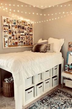 a bed room with a neatly made bed and lots of storage boxes on the floor