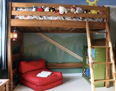 there is a bunk bed with a red chair in the corner and many stuffed animals on it