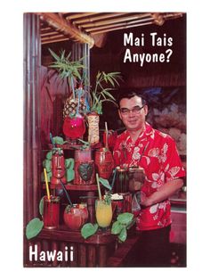 a man standing in front of a table filled with drinks