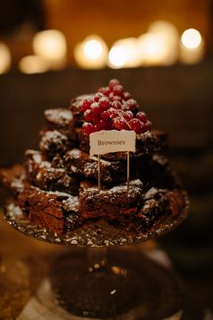 chocolate brownies with raspberries on top in a glass dish