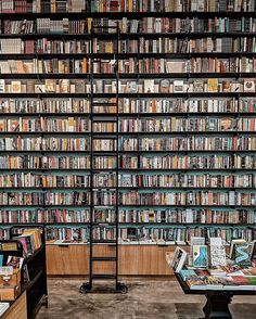 a room filled with lots of books on shelves