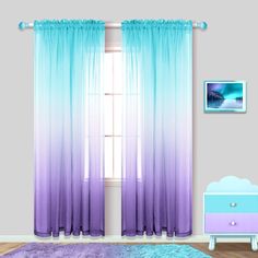 a bedroom with purple and blue curtains on the window sill, bedding and dresser