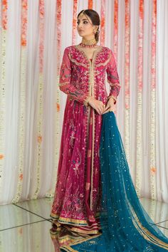 Add a touch of Regal splendor with this stunning pink front open kalidar richly adorned with intricate zardozi and botanical embroidery all over neckline, hem, sleeves and back. Sparkly sequins and motifs add a dazzling touch that ensures you shine brightly at any festive occasion. Rich textured pure jamawar lehenga and choli compliments kalidar perfectly, enhancing the outfit’s luxurious appeal. Kalidar & dupatta Fabric: French NetLehanga & Choli Fabric: Pure JamawarColor: Deep Pink & Teal This Pink Chanderi Dress With Intricate Embroidery, Festive Front Open Dress With Sheer Dupatta, Pink Chinon Dress With Dabka Work, Semi-stitched Dress With Resham Embroidery And Front Open Design, Semi-stitched Front Open Dress With Resham Embroidery, Wedding Dresses With Resham Embroidery And Front Open, Unstitched Anarkali Jamawar Gown, Bollywood Jamawar Gown With Dabka Work, Unstitched Jamawar Anarkali Gown