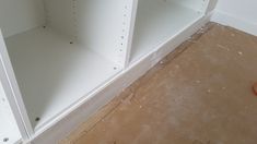 an empty shelf in the corner of a room that is being remodeled with white paint