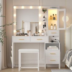 a white vanity with lights on it in a room next to a bed and window