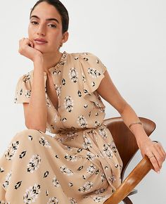 Step into the season with the Ann Taylor Petite Floral Flutter Sleeve Midi Flare Dress, a charming ensemble perfect for any summer occasion. This dress features a delightful floral pattern that captures the essence of warm-weather days.

- Size: Petite 2XS
- Color: Baguette
- Material: 100% Polyester
- Gender: Female
- Design Details: Ruffle split neck, flutter sleeves with shirred caps, elasticized self-tie waist
- Length: 27" from natural waist
- Hem: Peplum style
- Care: Machine washable

Cra Shirred Sleeve, Midi Flare Dress, Getaway Dress, Female Design, She Wolf, Peplum Styles, Girl Things, Work Style, Clothing Inspiration