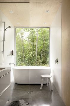 a white bath tub sitting next to a window