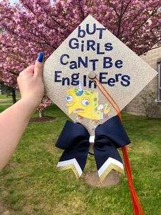 someone is holding up a graduation cap that says, but girls can't be engineers