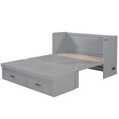 an image of a bed with drawers on the bottom and bottom drawer open to reveal a mattress