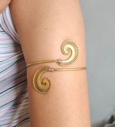 Spiral Arm Cuff arm band  METAL :- Brass ❥ Customers satisfaction is our biggest priority, please contact us with any questions/queries for future or existing orders, and we will do our best to make sure you are happy with your order. ♥ Please Make Sure to Include The Correct Address During Before Order. You Can return Item within 30 Days After Successful Delivery. We Offer 100% Money Back Guarantee If You Not Satisfied With Your Purchase. Return Charge Will Be Paid By Buyer Only. This is my sho Handmade Adjustable Spiral Cuff Bracelet, Band Metal, Arm Cuff, Body Jewellery, Arm Band, Body Jewelry, Etsy Accessories, Cuff, Electronic Accessories