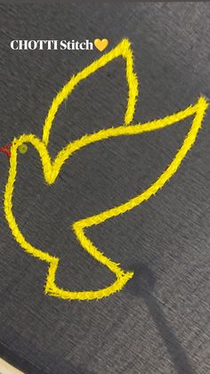 a yellow bird drawn on top of a piece of fabric with the words chotti stitch