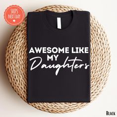 a black t - shirt that says, awesome like my daughter