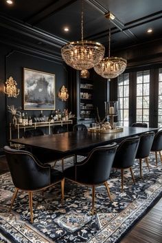 an elegant dining room with black walls and chandelier hanging over the large table