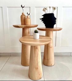 two wooden tables sitting next to each other