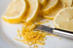 sliced lemons on a plate with a knife