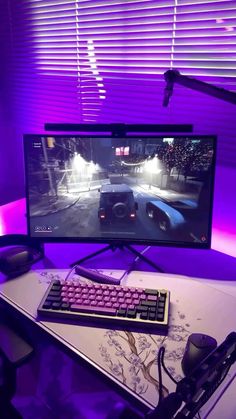 a computer monitor sitting on top of a desk in front of a keyboard and mouse