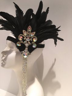 Black Feather Headpiece- Feather 20's Stretch Headdress- Flapper Headband- Black Head Wrap- Handmade in USA- Speakeasy Hello, Stand out in the crowd with this stunning 1920's headpiece. You'll be one of the best dressed at the party! This black feathers are Coque feathers that stand 10 inches high. The clear or ab rhinestone piece measures about 10 inches by 4 inches wide. They are placed on a silver or black sparkle stretch band that fits any head size and very comfortable. Rhinestone Colors: A Elegant Black Headpiece For Carnival, Fitted Headband Costume Accessories For Party, Formal Gatsby Headpiece With Feathers, Fitted Headband For Party, Fitted Headband For Parties, Gatsby Style Feather Headband, Vintage Black Headpieces For Parties, Flapper Evening Headpiece With Feathers, Formal Carnival Headband Headpiece