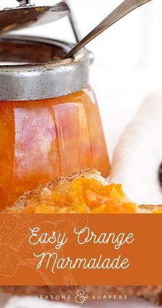 an orange marmalade in a jar with a spoon