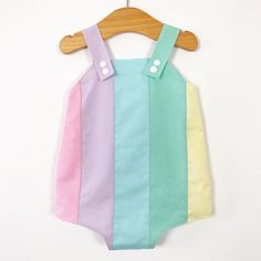 Pastel rainbow baby romper. Poppers for easy changing, relaxed fit, plenty of room for nappies (cloth or disposable). Fully lined with light soft cotton. Seamless insides making them comfortable against babies skin. Pastel rainbow design, repeated on the back. Carefully selected colours of luxury cotton. Adjustable length straps. Spring Multicolor Onesie For Playtime, Multicolor Spring Bodysuit For Playwear, Spring Multicolor Bodysuit For Playwear, Summer Cotton Overalls For Playwear, Multicolor Cotton Bodysuit For Spring, Spring Multicolor Cotton Bodysuit, Summer White Onesie For Bedtime, White Summer Onesie For Bedtime, Playful Summer Onesie For Bedtime