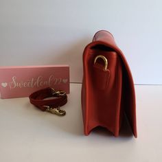 "Vtg Coach Original Convertible Clutch Red soft and supple leather with brass hardware Roomy interior with one inner zippered pocket, outer slip pocket covered by a flap and secured with a turnlock Detachable 40\" strap Hang tag and chain Measures: 11 5\"L, 7.5\"H, 2\"W Made in the United States #211-0972 Amazing condition Cleaned, conditioned and ready to wear! Questions? Just ask More vintage coach styles/colors are also available G64" Office Satchel With Gold-tone Hardware And Flap, Retro Business Shoulder Bag With Detachable Strap, Retro Flap Bag With Detachable Strap For Travel, Formal Red Satchel Saddle Bag, Formal Red Saddle Bag Satchel, Retro Business Shoulder Bag With Gold-tone Hardware, Daily Use Bag With Gold-tone Hardware And Double Flap, Daily Use Bag With Double Flap And Gold-tone Hardware, Red Leather-lined Satchel For Travel