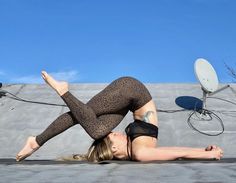 a woman is laying on the ground with her legs spread out in front of her